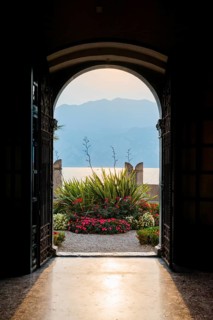 View from the inside of a city villa, light, sun, sunbeam, backlight, dramatic, architecture,