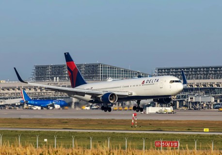 Stuttgart Airport with terminal, Delta Air Lines aircraft landing. Boeing 767-300. Stuttgart