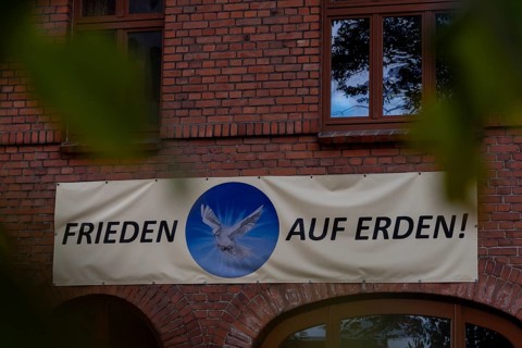 Peace on Earth lettering, Plau am See, Mecklenburg-Vorpommern, Germany, Europe