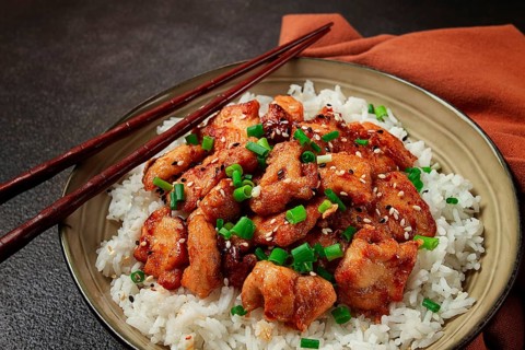 Fried chicken teriyaki with rice, green onion and sesame, homemade, no people