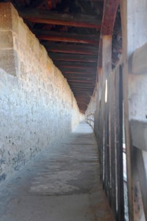 Covered long walkway of the historic town fortifications, town wall, interior view, vanishing