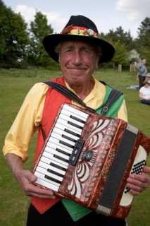 Portrait of accordion player for Morris dancers at country folk event, Shottisham, Suffolk,