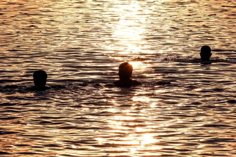 Swimming at sunset in Schlachtensee, Berlin, 11/08/2022 -