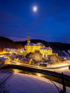Winter evening in the Müglitz valley, impressively illuminated Weesenstein Castle at the blue hour,