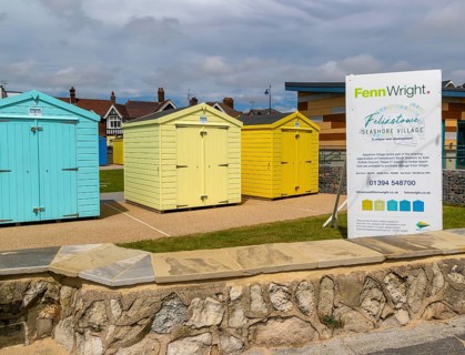 Fenn Wright estate agent sign Seashore Village beach huts for sale, Felixstowe, Suffolk, England,