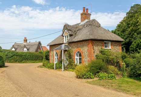 Flint and thatched historic country cottages former estate worker's home, Sutton, Suffolk, England,