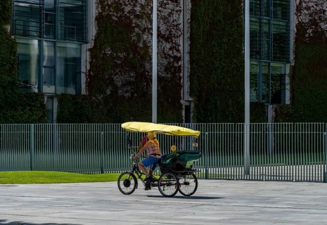 Tourists on bicycles, fence at the Federal Chancellery, Berlin, Germany, Europe