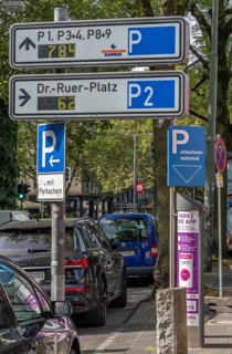 Parking in public spaces via parking app, EasyPark, here in Bochum, parking ticket machine where