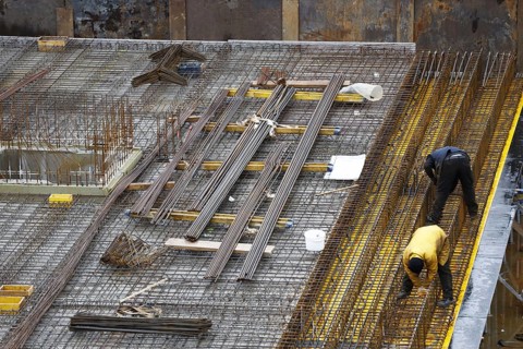 Construction site, reinforced concrete reinforcement bars, for a building ceiling, are installed