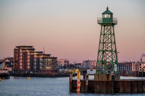Skyline of Bremerhaven, seen over the Weser, lighthouse at the mouth of the Geeste, harbour of the