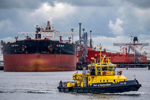 Large tanker for crude oil, Blü Nova, being unloaded, inland waterway vessel, harbour tug, in the