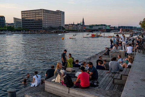 Summer evening in Copenhagen, at the harbour, Islands Brygge, people celebrating, eating, drinking,