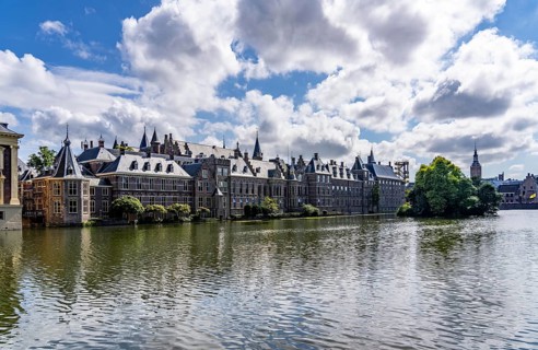 The historic Binnenhof, seat of the Dutch government, Hofvijver pond, skyline of the city centre at