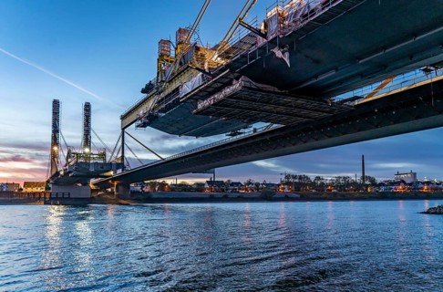 New construction of the motorway bridge Neuenkamp of the A40, over the Rhine near Duisburg, evening
