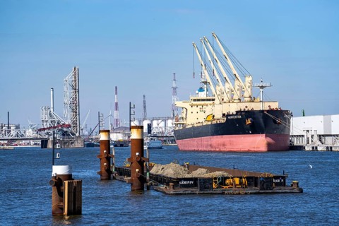 The port of Antwerp, on the Scheldt, is the second largest seaport in Europe, freighter harvester