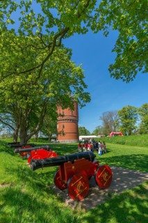 Nyborg Castle, medieval fortress with moat and ramparts, brick building, festival with soldiers in
