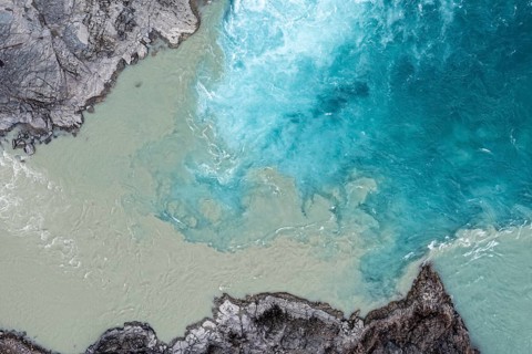 Confluence of river Rio Baker and Rio Neff, aerial view, muddy water of Rio Neff merges with