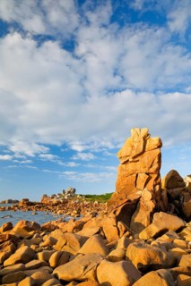 Striking orange-coloured rock formations in the evening light, on the coast of the English Channel