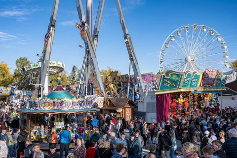 Crowd of people on fairground, amusement park, amusement ride, Ferris wheel, showmen, on the