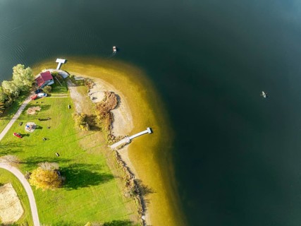 Sports facility and bathing area, lake Rottachsee, at village Petersthal, autumn, aerial view,