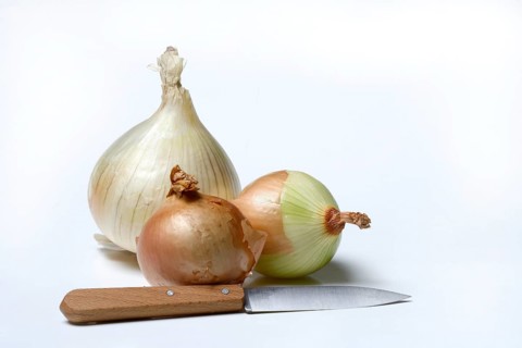Various onions on wooden board with knife, onion, Allium cepa
