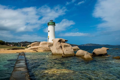 Lighthouse with beach and bizarre granite rocks, Spiaggia Porto Faro, Faro di Punta Palau, Palau,
