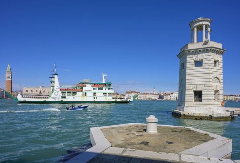 Lighthouse at the marina of San Giorgio Maggiore and passing car ferry, Venice, Metropolitan City