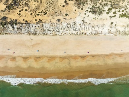 Beach life at the Asperillo cliff, the highest dune cliff in Europe. At the Atlantic Ocean near