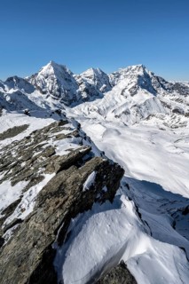 Mountain panorama with snow-covered mountain landscape in winter, view of mountain peaks