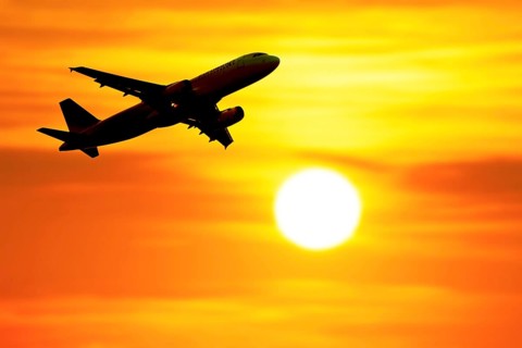 Photomontage, Departing passenger plane in front of the sun, Baden-Württemberg, Germany, Europe