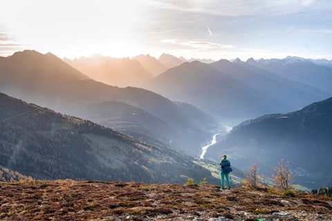 Hiker on the Venet, Upper Inn Valley in the morning light, view from Venet, Ötztal Alps, Tyrol,