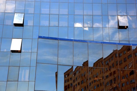 Small Wallachia, town of Drobeta Turnu Severin, building with glass façade by Rom Telekom, Romania,
