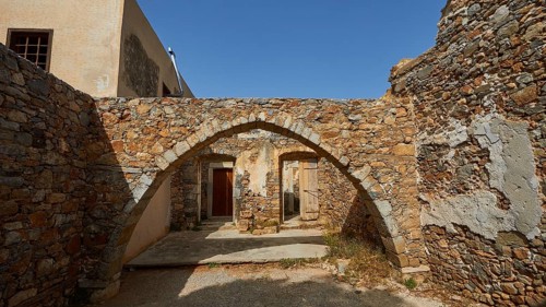 A building with stone arches and ancient walls illuminated by daylight, Venetian Sea Fortress,
