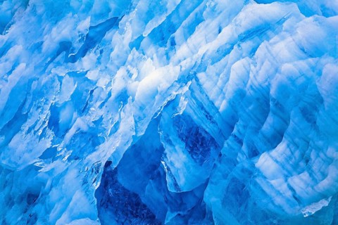 Blue ice patterns on a glacier wall in the arctic, Svalbard, Norway, Europe