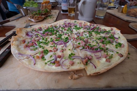 Alsatian-style tarte flambée with bacon and onions, served in a beer garden, Franconia, Bavaria,