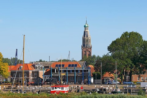 Small harbour and town view of Enkhuizen with tower of the Zuiderkerk church, Enkhuizen, North