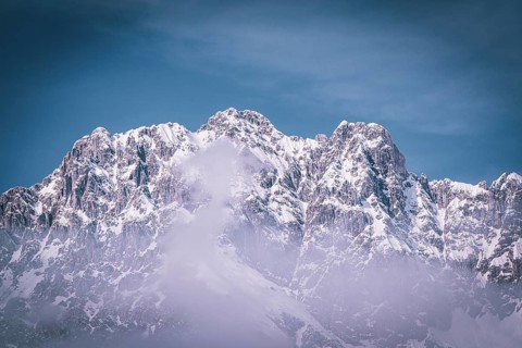 Majestic snow-covered mountain range under a clear sky in winter, Kaisergebierge, The Mountain