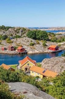View of summer house by a rocky coast in the archipelago on the Swedish west coast on a sunny