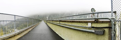 View of the path on the dam wall of the Zufritt reservoir, power station, hydroelectric power plant