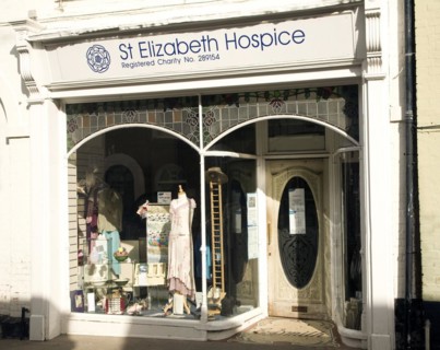 Charity shop window display, St Elizabeth Hospice, Woodbridge, Suffolk, England, United Kingdom,