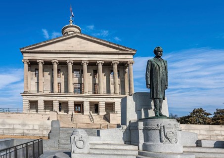 Statue of Edward Ward Carmack on the steps of the Tennessee state capitol building in downtown