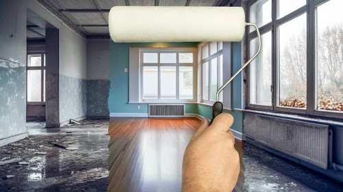 Before and after of man using painting roller to reveal finished office space under unfinished
