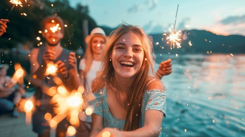 Young adults having fun with sparklers at the lake. generative AI, AI generated