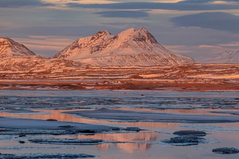 Morning light on Bergen on the coast, icy fjord, Breiddalsvik, East Fjords, Iceland, Europe