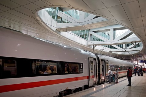 ICE at the centre platform with the large opening to the glass dome, long-distance train station,