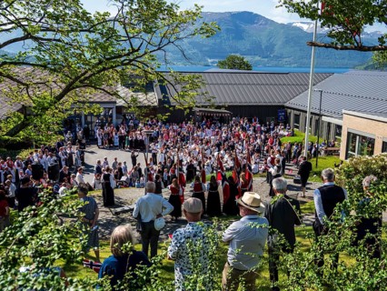 Norwegian national day celebration, 17. may, parade with music, norwegian flags, village Rosendal,