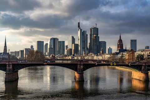 Skyline of the city centre of Frankfurt am Main, river Main, Ignatz-Bubis-Bridge, dusk, Hesse,