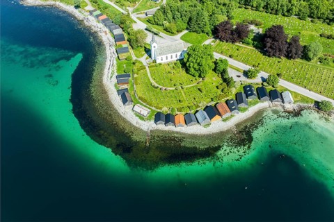 Aerial view of beach and church in Selje, wooden boat sheds, Stad, Vestland, Norway, Europe