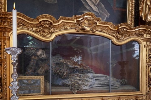 Magnificent glass shrine with decorated bones of a catacomb saint, Basilica of St Mauritius,