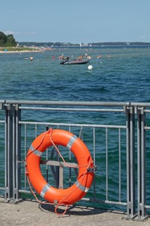 Lifebuoy, ferry pier, inflatable boat, people, Falckenstein, Kiel, Kiel Fjord, Schleswig-Holstein,